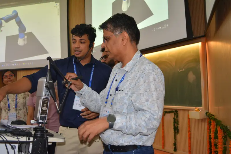 A participant tries the haptic controller. HAIR Workshop, IIT Mandi