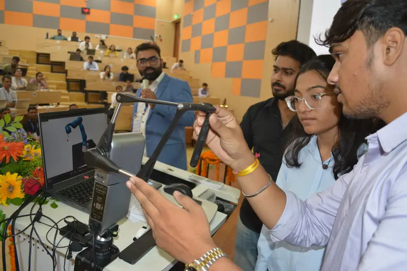 Students tele-operate a simulated arm. HAIR Workshop, IIT Mandi